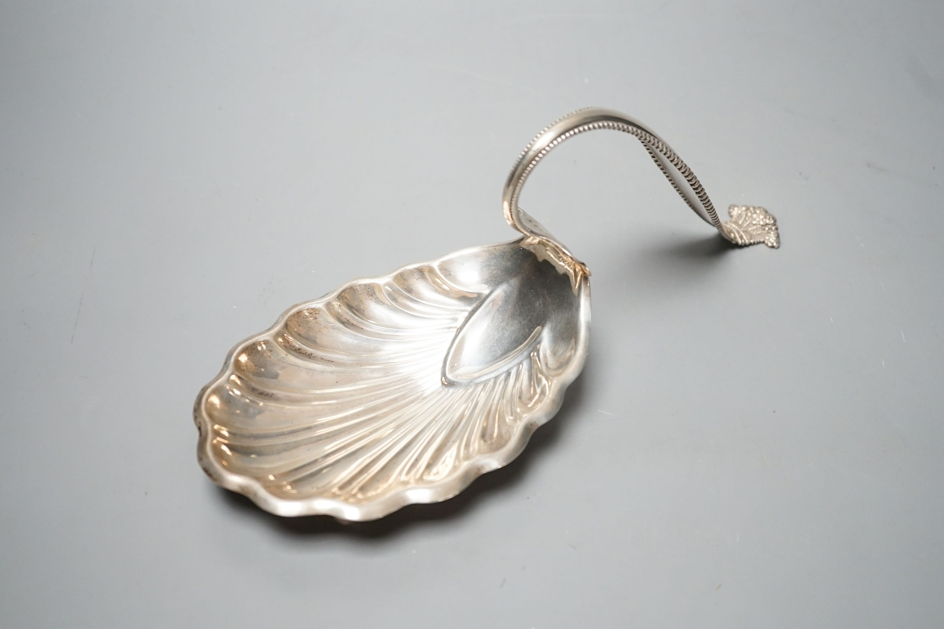 A sterling spoon shaped shell dish, by George W Schleiber & Co, 26.5cm, 6oz.